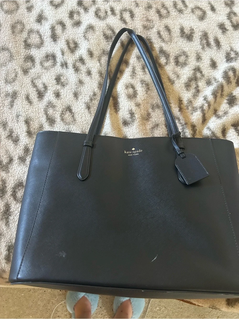 kate spade black leather tote with luggage tag charm